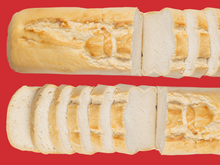 Load image into Gallery viewer, Bread SRSLY gluten-free sourdough loaves on a red background.