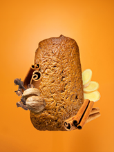 Load image into Gallery viewer, Pumpkin Spice Loaf with Ingredients (cinnamon, ginger, clove, nutmeg) on an orange background.