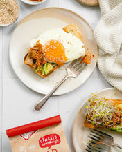 Load image into Gallery viewer, Bread SRSLY Gluten-Free Sourdough Toast topped with avocado, kimchi and a fried egg on a plate with a fork. 