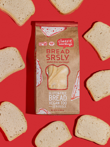 Bread SRSLY gluten-free sourdough on a red background with gluten-free classic sourdough slices scattered around.