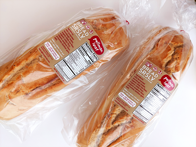 Bread SRSLY gluten-free sourdough pullman loaves pictured front facing on a white background. Extra large gluten-free bread slices. 