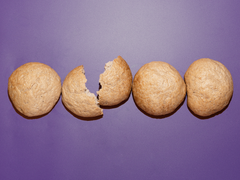 Bread SRSLY gluten-free sourdough sandwich rolls on a purple background.